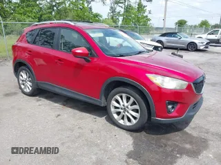 2014 Mazda CX-5 Grand Touring with VIN JM3KE2DY3E0382920, listed as a IAAI auction lot 42102876 with 324,608 mi miles. Bid and sale history available at carsss.com. Image 1.