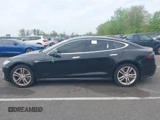 2014 Tesla Model S 60 with VIN 5YJSA1H13EFP33693, listed as a IAAI auction lot 42132094 with Not Provided miles and . Bid and sale history available at DreamBid. Image 13.