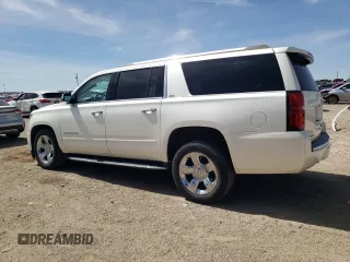 2015 Chevrolet Suburban LTZ with VIN 1GNSKKKC1FR659707, listed as a Copart auction lot 50202895 with 91,680 mi miles and Salvage Title. Bid and sale history available at DreamBid. Image 2.