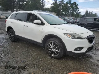 2014 Mazda CX-9 Grand Touring with VIN JM3TB2DA5E0438288, listed as a Copart auction lot 56970705 with 147,526 mi miles and Salvage title. Bid and sale history available at DreamBid. Image 4.