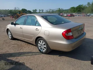 2002 Toyota Camry XLE z VIN 4T1BF30K02U001246, wystawiony jako IAAI lot #42334251 z przebiegiem 58 575 mil mil oraz . Historia ofert i sprzedaży dostępna na DreamBid. Obrazek 3.