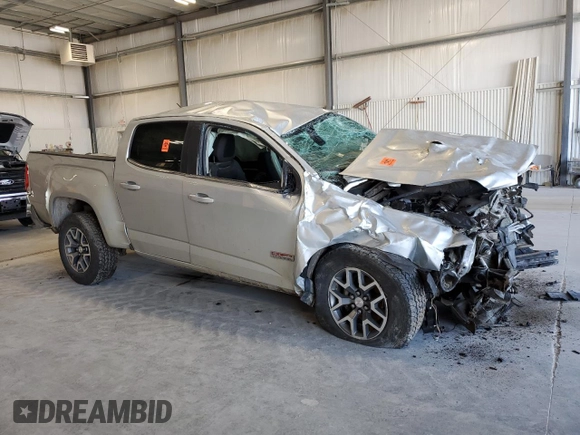 2015 GMC Canyon 4WD SLE with VIN 1GTG6BE36F1263317, listed as a Copart auction lot 53967805 with 129,590 mi miles and Salvage title. Bid and sale history available at DreamBid. Image 4.