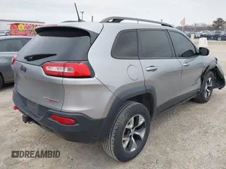 2016 Jeep Cherokee Trailhawk with VIN 1C4PJMBS7GW192574, listed as a IAAI auction lot 41986638 with 144,970 mi miles and . Bid and sale history available at DreamBid. Image 4.