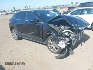 2022 Mazda CX-30 S Premium with VIN 3MVDMBDL6NM407913, listed as a IAAI auction lot 42359860 with 35,804 mi miles and . Bid and sale history available at DreamBid. Image 1.