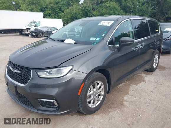 2023 Chrysler Pacifica Touring L with VIN 2C4RC1BG8PR594481, listed as a IAAI auction lot 42618839 with 60,748 mi miles and . Bid and sale history available at DreamBid. Image 2.