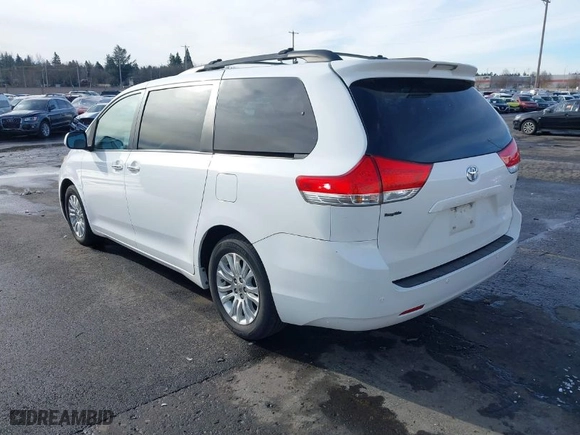 2012 Toyota Sienna XLE AAS with VIN 5TDYK3DC7CS267673, listed as a IAAI auction lot 41493549 with 176,845 mi miles. Bid and sale history available at carsss.com. Image 3.