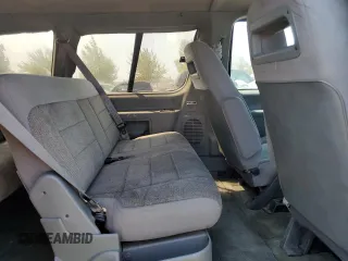 1993 Ford Aerostar with VIN 1FMCA11U0PZB97965, listed as a Copart auction lot 65148054 with 86,569 mi miles and Salvage Title. Bid and sale history available at carsss.com. Image 12.