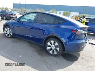2020 Tesla Model Y Long Range with VIN 5YJYGDEE1LF006227, listed as a IAAI auction lot 42100833 with 49,761 mi miles and . Bid and sale history available at DreamBid. Image 3.