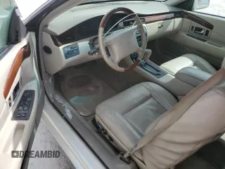 2002 Cadillac Eldorado z VIN 1G6EL12Y32B102263, wystawiony jako Copart lot #77108634 z przebiegiem 43 162 mil mil oraz Nie do naprawy • Non repairable. Historia ofert i sprzedaży dostępna na DreamBid. Obrazek 8.