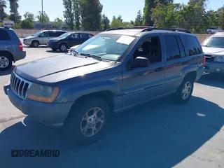 2001 Jeep Grand Cherokee Laredo with VIN 1J4GW48S31C550460, listed as a IAAI auction lot 42769410 with 261,640 mi miles and . Bid and sale history available at DreamBid. Image 2.
