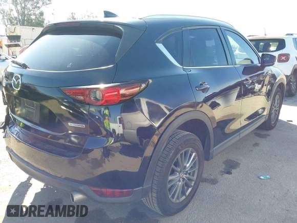 2019 Mazda CX-5 Sport with VIN JM3KFABM7K1579747, listed as a IAAI auction lot 41965097 with 151,042 mi miles and . Bid and sale history available at DreamBid. Image 4.