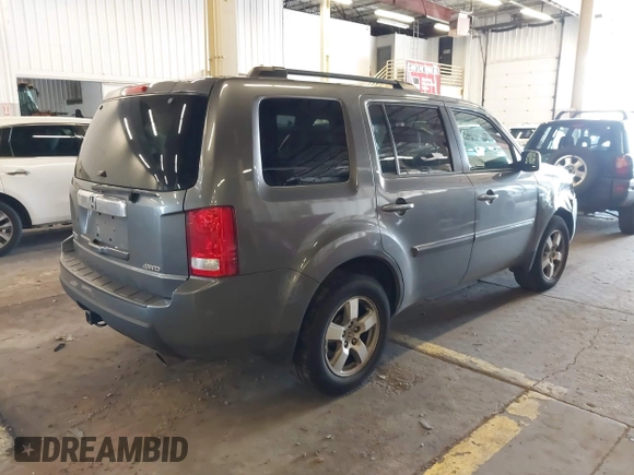2011 Honda Pilot EX-L with VIN 5FNYF4H65BB020721, listed as a IAAI auction lot 41794436 with 113,630 mi miles and . Bid and sale history available at carsss.com. Image 4.