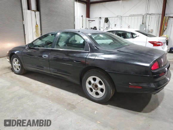 1999 Oldsmobile Aurora with VIN 1G3GR62C8X4117519, listed as a Copart auction lot 77984084 with 188,949 mi miles and Clean Title. Bid and sale history available at DreamBid. Image 2.
