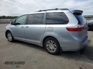 2015 Toyota Sienna XLE with VIN 5TDYK3DC2FS529006, listed as a Copart auction lot 62750995 with 142,990 mi miles and Salvage title. Bid and sale history available at DreamBid. Image 2.