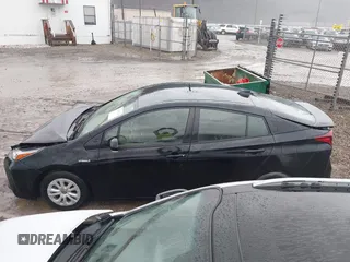 2021 Toyota Prius L Eco with VIN JTDKAMFU5M3145210, listed as a IAAI auction lot 41482234 with 85,600 mi miles and . Bid and sale history available at DreamBid. Image 15.
