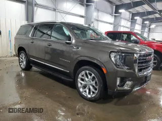 2021 GMC Yukon XL SLT with VIN 1GKS2GKD1MR434218, listed as a Copart auction lot 82777494 with 60,601 mi miles and Salvage Title. Bid and sale history available at carsss.com. Image 4.