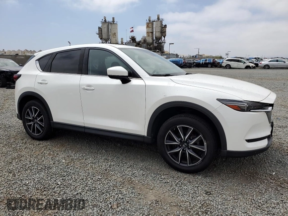 2018 Mazda CX-5 Grand Touring with VIN JM3KFADMXJ1358221, listed as a Copart auction lot 59746545 with 54,094 mi miles and Salvage title. Bid and sale history available at DreamBid. Image 4.