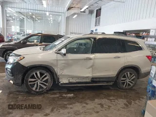 2017 Honda Pilot Touring with VIN 5FNYF6H92HB032873, listed as a IAAI auction lot 41608870 with 123,888 mi miles. Bid and sale history available at carsss.com. Image 14.