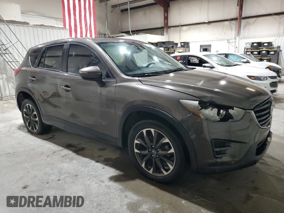 2016 Mazda CX-5 Grand Touring z VIN JM3KE2DY5G0821683, wystawiony jako Copart lot #51929905 z przebiegiem 119 392 mil mil oraz Czysty tytuł • Clean title. Historia ofert i sprzedaży dostępna na DreamBid. Obrazek 4.