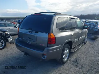 2005 GMC Envoy SLE with VIN 1GKDT13S852362380, listed as a IAAI auction lot 42031727 with 76,711 mi miles. Bid and sale history available at carsss.com. Image 4.