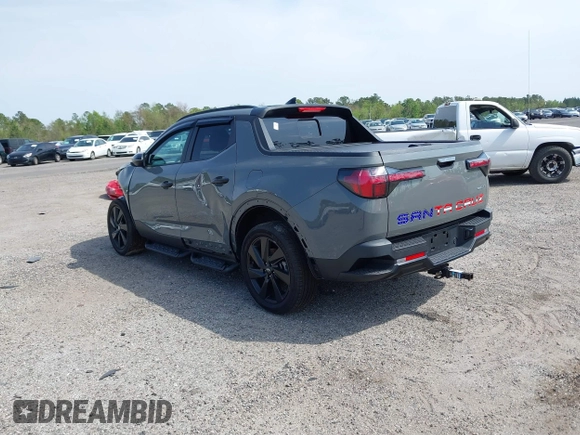 2023 Hyundai Santa Cruz Night Edition z VIN 5NTJCDAF0PH054192, wystawiony jako IAAI lot #40734723 z przebiegiem 9 700 mil mil oraz . Historia ofert i sprzedaży dostępna na DreamBid. Obrazek 3.