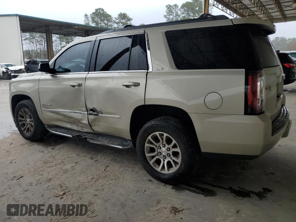 2015 GMC Yukon SLE with VIN 1GKS1AKC5FR120713, listed as a Copart auction lot 48009325 with 133,372 mi miles and Salvage Title. Bid and sale history available at carsss.com. Image 2.