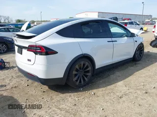 2022 Tesla Model X Plaid z VIN 7SAXCBE6XNF340704, wystawiony jako IAAI lot #41928524 z przebiegiem Nie podano mil oraz . Historia ofert i sprzedaży dostępna na DreamBid. Obrazek 4.