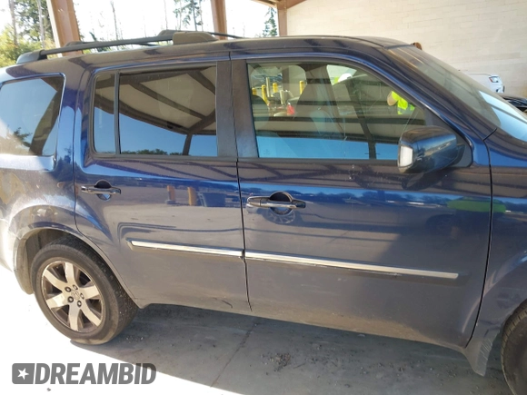 2013 Honda Pilot Touring with VIN 5FNYF4H95DB079782, listed as a IAAI auction lot 42737391 with 152,830 mi miles and . Bid and sale history available at DreamBid. Image 13.