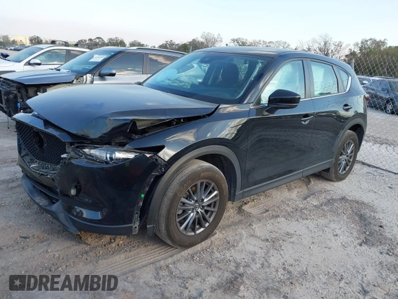 2019 Mazda CX-5 Sport with VIN JM3KFABMXK0693540, listed as a IAAI auction lot 41523569 with 57,895 mi miles and . Bid and sale history available at DreamBid. Image 2.
