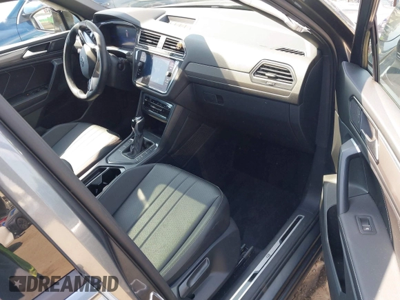 2023 Volkswagen Tiguan SE R-Line Black with VIN 3VVCB7AX8PM036684, listed as a IAAI auction lot 42169004 with 25,024 mi miles and . Bid and sale history available at DreamBid. Image 5.
