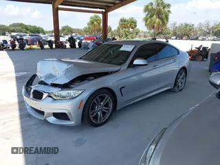2015 BMW 4 Series 428i with VIN WBA4A5C58FD410076, listed as a IAAI auction lot 39384271 with 125,987 mi miles and . Bid and sale history available at DreamBid. Image 2.