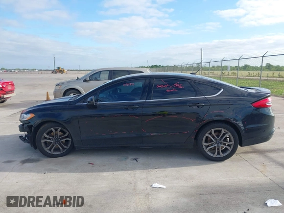 2017 Ford Fusion S with VIN 3FA6P0G75HR353909, listed as a IAAI auction lot 42024272 with 151,383 mi miles. Bid and sale history available at carsss.com. Image 15.