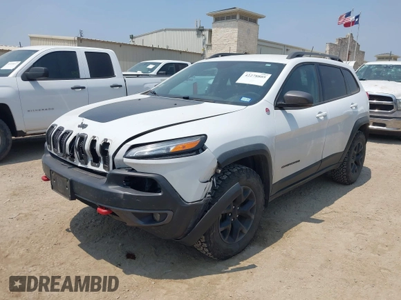 2015 Jeep Cherokee Trailhawk z VIN 1C4PJMBS5FW574102, wystawiony jako IAAI lot #42278805 z przebiegiem 164 250 mil mil oraz . Historia ofert i sprzedaży dostępna na DreamBid. Obrazek 2.