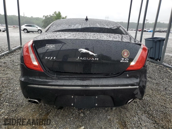 2014 Jaguar XJ Portfolio with VIN SAJWJ2GD5E8V69982, listed as a Copart auction lot 58933515 with 92,847 mi miles and Salvage title. Bid and sale history available at DreamBid. Image 6.
