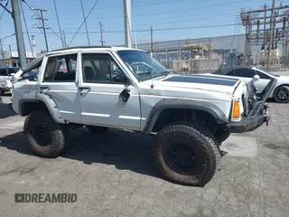 1991 Jeep Cherokee Country z VIN 1J4FJ78S7ML632675, wystawiony jako IAAI lot #42283175 z przebiegiem 116 062 mil mil oraz . Historia ofert i sprzedaży dostępna na DreamBid. Obrazek 13.