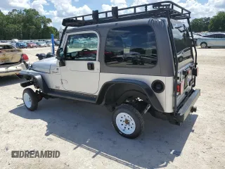 2005 Jeep Wrangler Sport z VIN 1J4FA49S75P324462, wystawiony jako Copart lot #59818995 z przebiegiem 183 558 mil mil oraz Nie do naprawy • Non repairable. Historia ofert i sprzedaży dostępna na DreamBid. Obrazek 2.