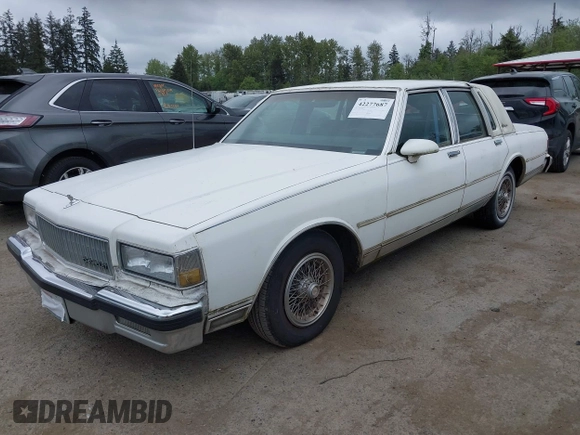 1990 Chevrolet Caprice z VIN 1G1BU54E9LA105479, wystawiony jako IAAI lot #42277687 z przebiegiem 30 947 mil mil oraz . Historia ofert i sprzedaży dostępna na DreamBid. Obrazek 2.