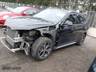 2018 BMW X1 xDrive28i with VIN WBXHT3C39J3H30531, listed as a IAAI auction lot 41890734 with 59,147 mi miles. Bid and sale history available at carsss.com. Image 21.