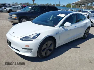 2019 Tesla Model 3 Mid Range with VIN 5YJ3E1EA1KF422983, listed as a IAAI auction lot 41861334 with 53,017 mi miles. Bid and sale history available at carsss.com. Image 2.
