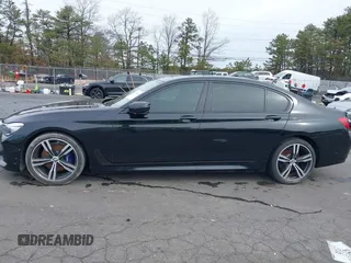 2019 BMW 7 Series 740i with VIN WBA7E2C57KB217973, listed as a IAAI auction lot 39064321 with 54,818 mi miles and . Bid and sale history available at DreamBid. Image 14.