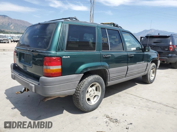 1996 Jeep Grand Cherokee Laredo z VIN 1J4GZ58S8TC222435, wystawiony jako Copart lot #62347665 z przebiegiem 202 125 mil mil oraz Czysty tytuł • Clean title. Historia ofert i sprzedaży dostępna na DreamBid. Obrazek 3.