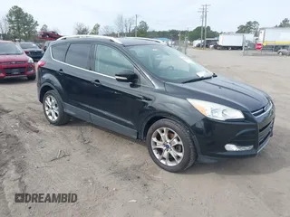 2015 Ford Escape Titanium with VIN 1FMCU9JX5FUB15563, listed as a IAAI auction lot 41768301 with 124,404 mi miles. Bid and sale history available at carsss.com. Image 1.