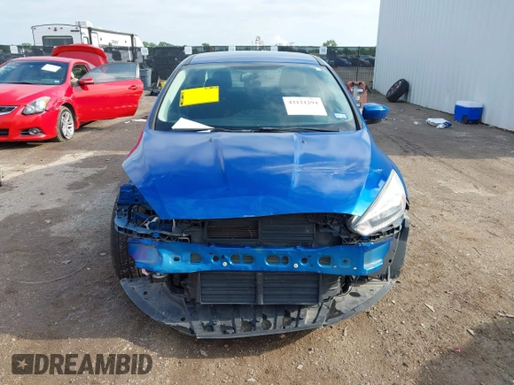2018 Ford Focus SE z VIN 1FADP3F2XJL293337, wystawiony jako IAAI lot #42121294 z przebiegiem 71 241 mil mil oraz . Historia ofert i sprzedaży dostępna na DreamBid. Obrazek 12.