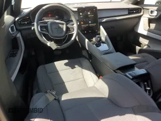 2024 Polestar 2 z VIN YSMFD3KA9RL210991, wystawiony jako Copart lot #58039505 z przebiegiem 18 091 mil mil oraz Szkody całkowita. Historia ofert i sprzedaży dostępna na DreamBid. Obrazek 8.