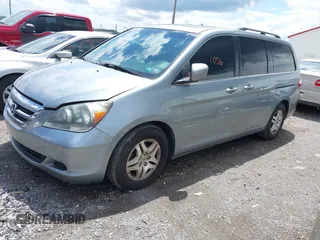 2007 Honda Odyssey EX-L with VIN 5FNRL38747B121059, listed as a IAAI auction lot 42211056 with 171,838 mi miles and . Bid and sale history available at DreamBid. Image 2.