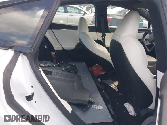 2021 Tesla Model S Long Range with VIN 5YJSA1E57MF428512, listed as a IAAI auction lot 42511020 with 29,611 mi miles and . Bid and sale history available at DreamBid. Image 8.