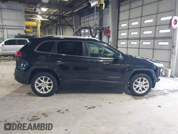 2015 Jeep Cherokee Latitude with VIN 1C4PJMCB5FW768854, listed as a IAAI auction lot 41246213 with 131,112 mi miles. Bid and sale history available at carsss.com. Image 13.