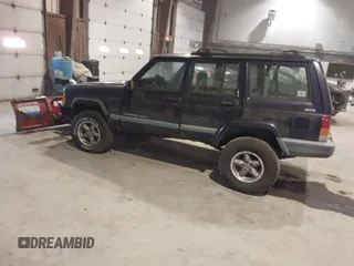 1999 Jeep Cherokee Sport with VIN 1J4FF68S2XL602709, listed as a IAAI auction lot 41177232 with Not Provided miles. Bid and sale history available at carsss.com. Image 3.