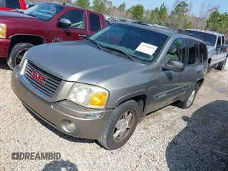 2003 GMC Envoy SLT z VIN 1GKDS13S932106295, wystawiony jako IAAI lot #41594814 z przebiegiem 199 597 mil mil oraz . Historia ofert i sprzedaży dostępna na DreamBid. Obrazek 2.