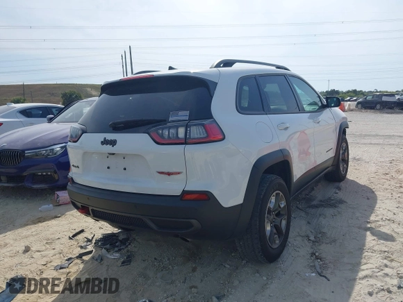 2019 Jeep Cherokee Trailhawk Elite with VIN 1C4PJMBN3KD487461, listed as a IAAI auction lot 41869751 with 91,197 mi miles and . Bid and sale history available at DreamBid. Image 4.